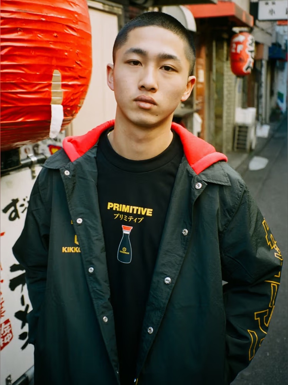 Primitive x Kikkoman Windbreaker Jacket with Red Hood and Yellow Logos
